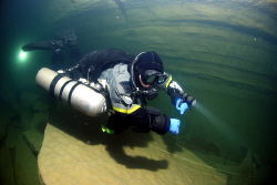 Diver in a cave in france in sidemount config. by Andy Kutsch 